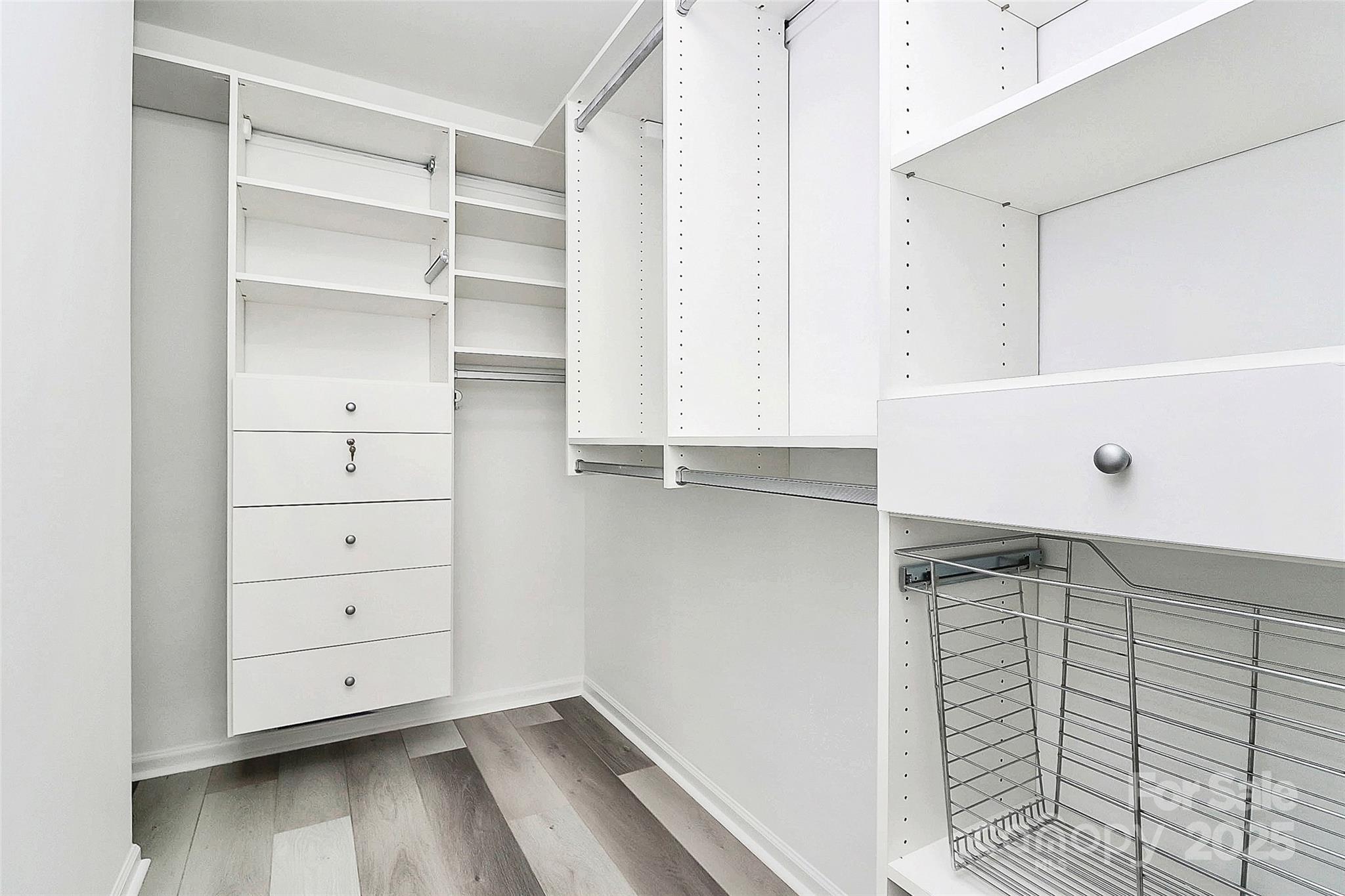 441 Robin Reed Court Pineville, NC 28134 - Photo 24 of 33 a view of walk in closet with empty racks