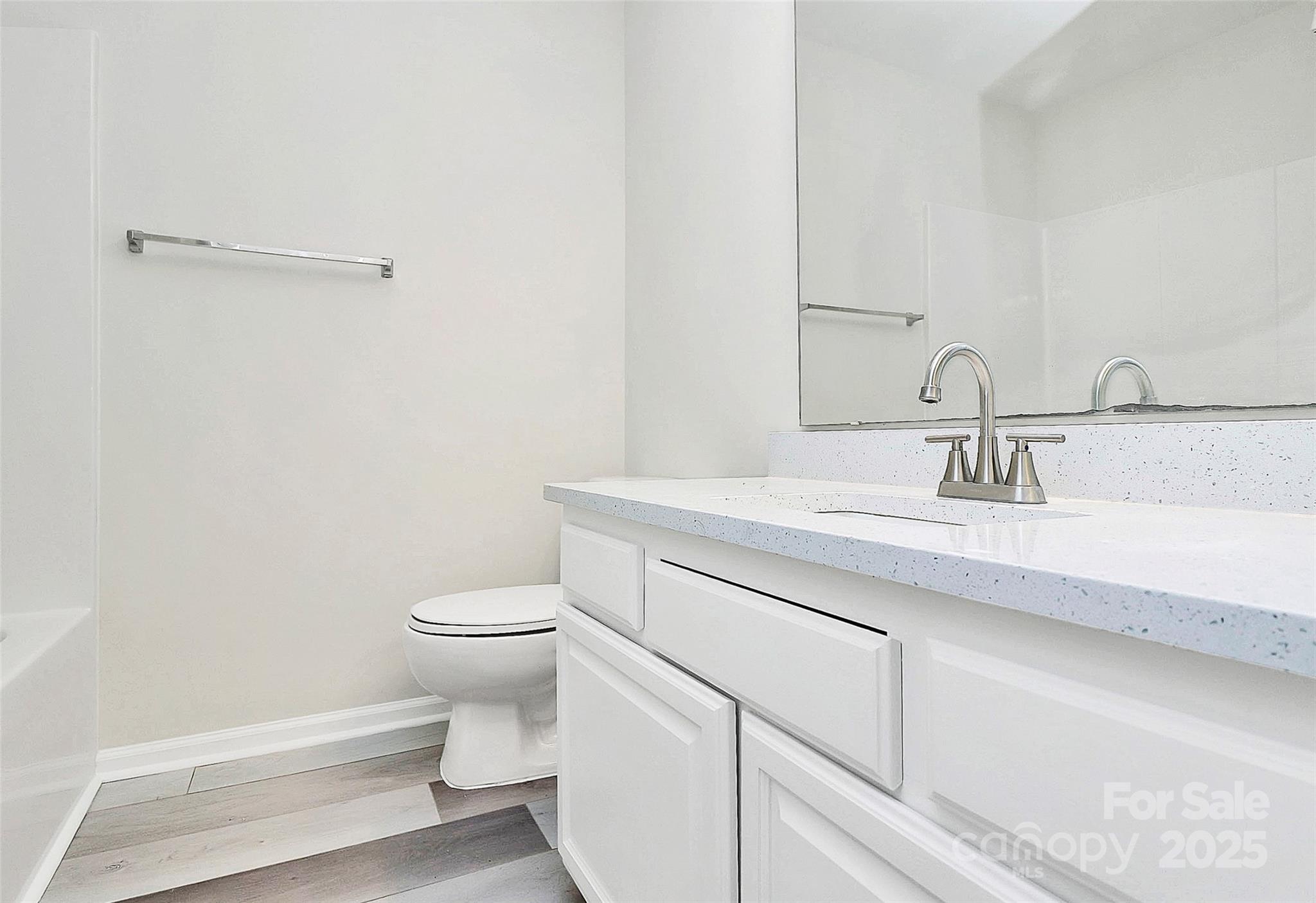 441 Robin Reed Court Pineville, NC 28134 - Photo 27 of 33 a bathroom with a granite countertop sink a toilet and a mirror