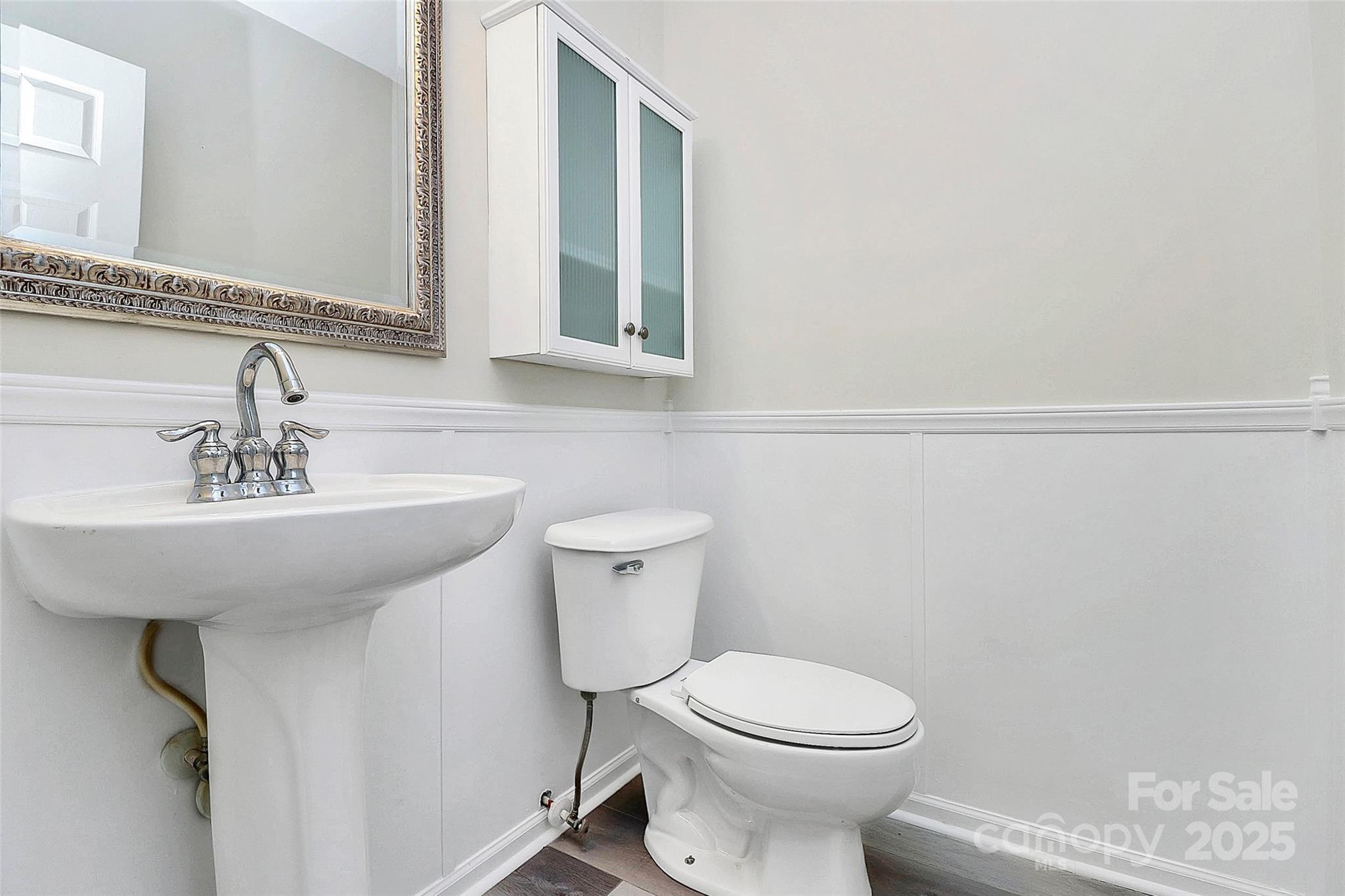 441 Robin Reed Court Pineville, NC 28134 - Photo 29 of 33 a bathroom with a sink toilet and mirror