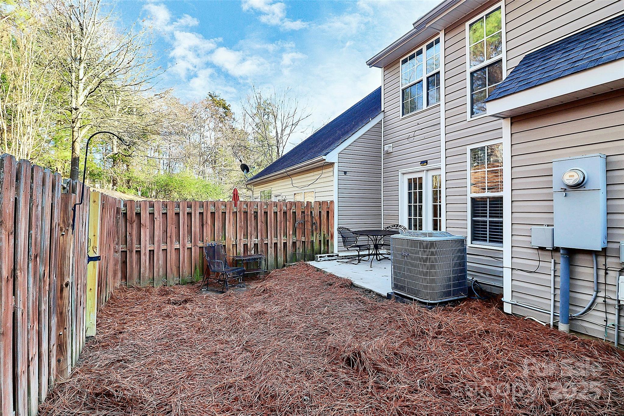 441 Robin Reed Court Pineville, NC 28134 - Photo 31 of 33 a backyard of a house with barbeque oven and wooden fence