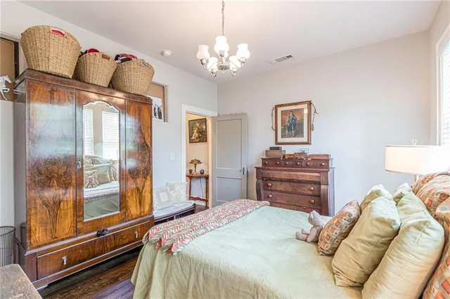 a bedroom with a bed and a table