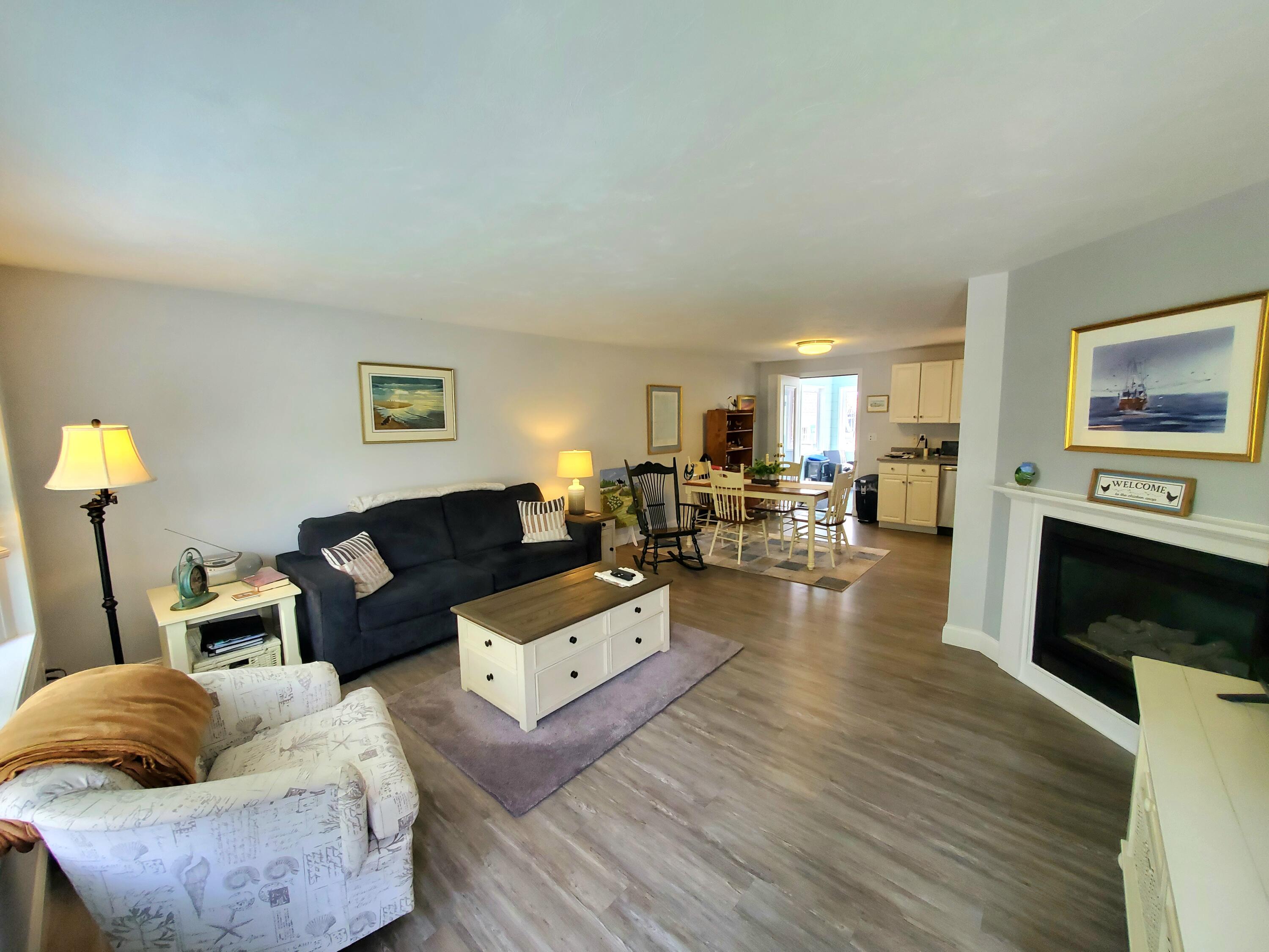 52 Thayer Road Dennis, MA 02660 - Photo 3 of 19 a living room with furniture and a flat screen tv