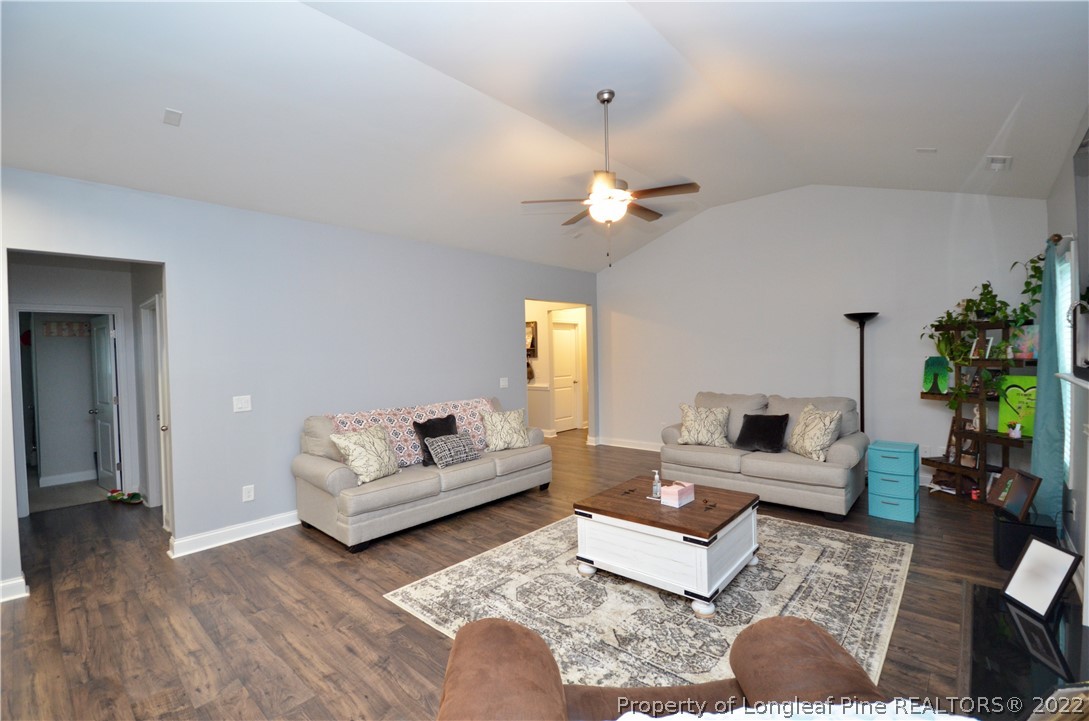 5216 Sunset View Road Hope Mills, NC 28348 - Photo 8 of 41 a living room with furniture and wooden floor