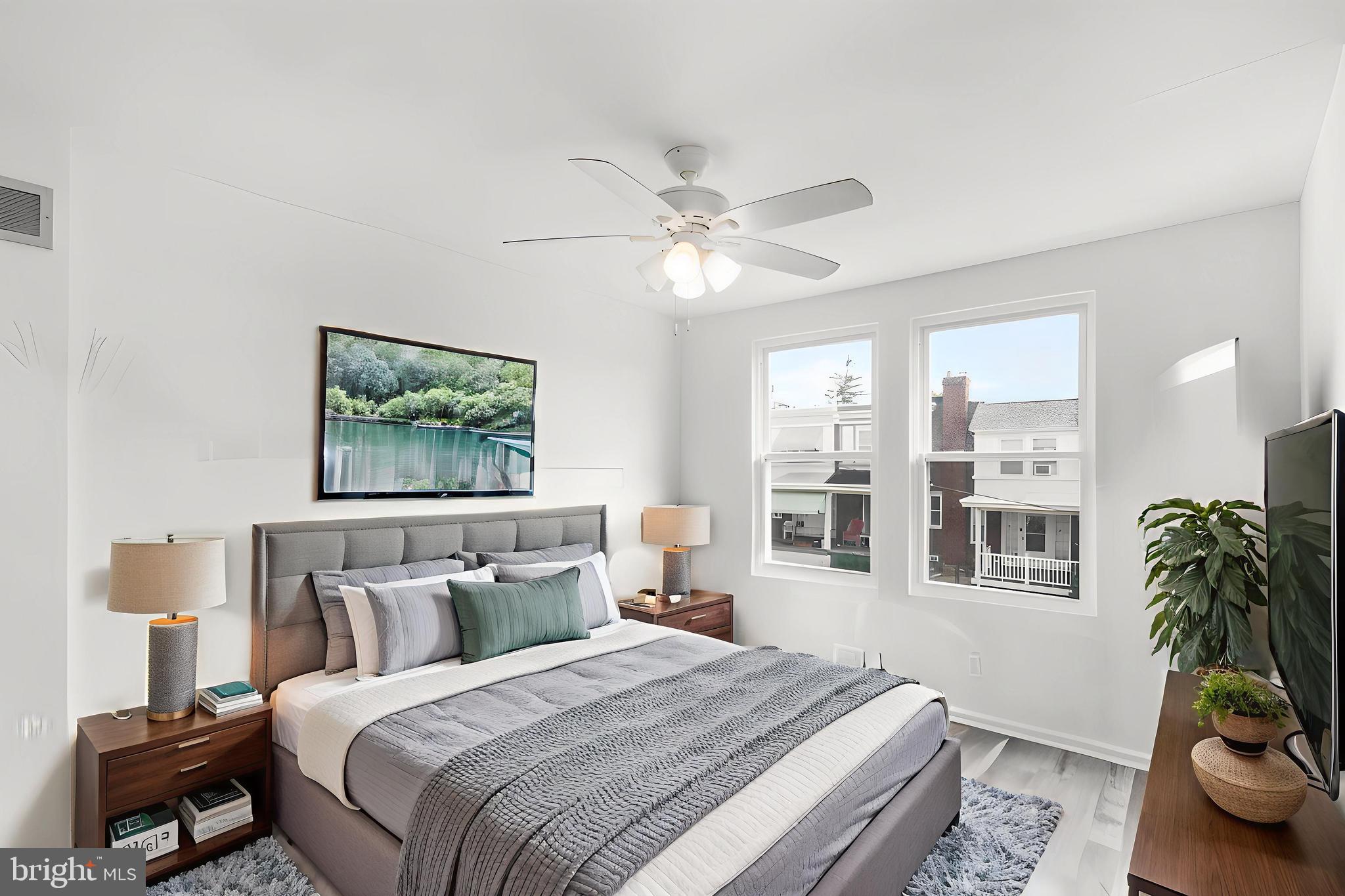 7734 Temple Road Philadelphia, PA 19150 - Photo 14 of 33 a bedroom with bed and a potted plant