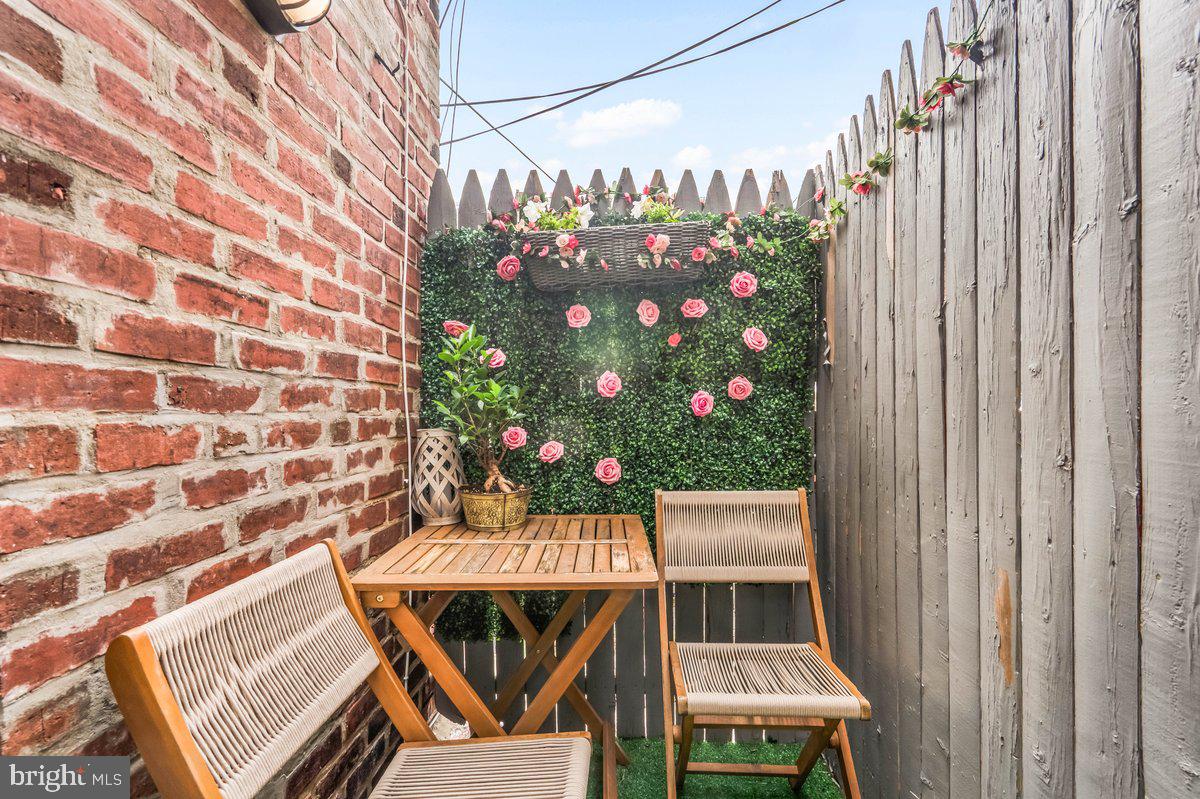 7734 Temple Road Philadelphia, PA 19150 - Photo 10 of 33 a balcony with table and chairs