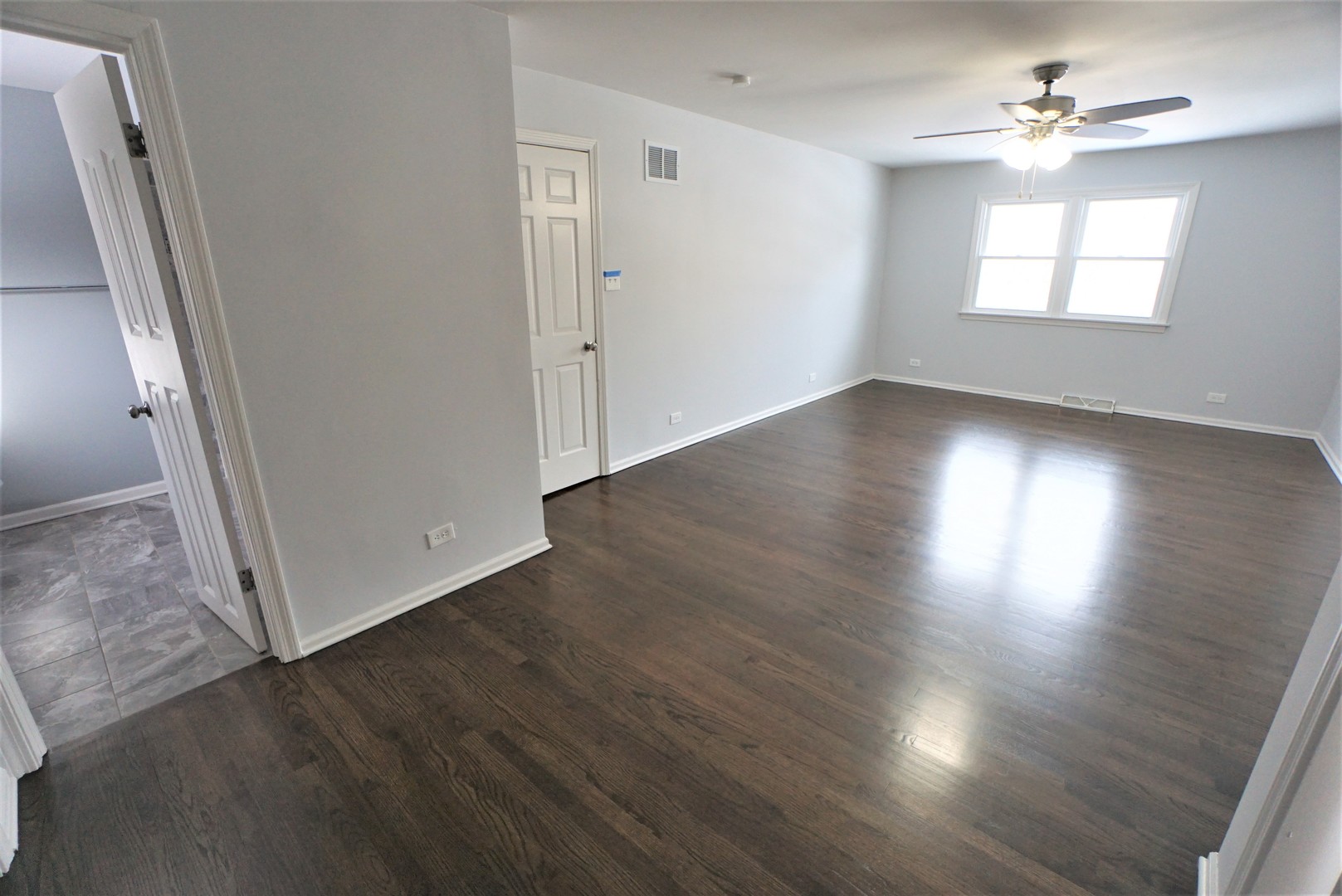 2842 Scott Crescent Flossmoor, IL 60422 - Photo 16 of 43 an empty room with wooden floor and windows