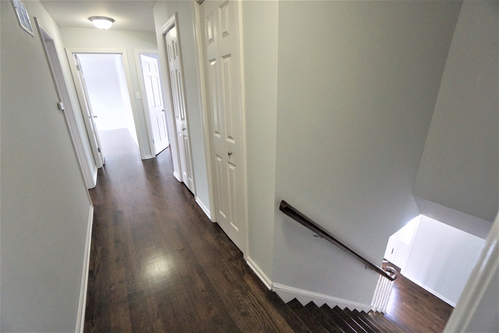 2842 Scott Crescent Flossmoor, IL 60422 - Photo 18 of 43 a view of a hallway with wooden floor and staircase