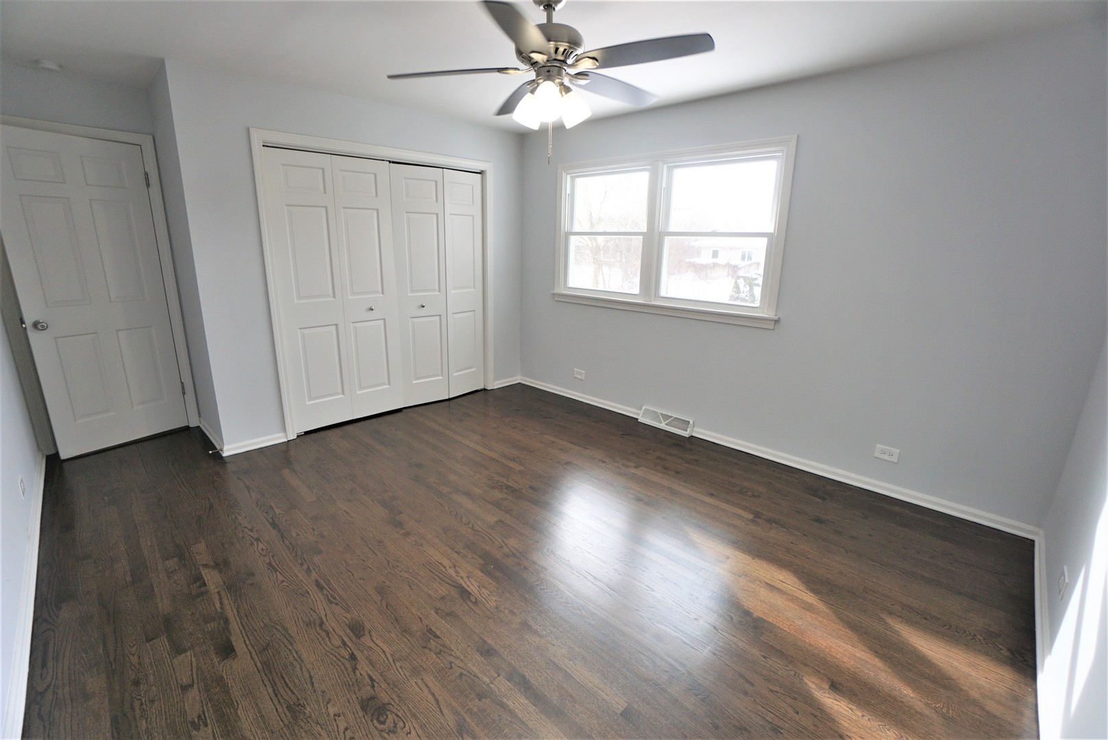 2842 Scott Crescent Flossmoor, IL 60422 - Photo 20 of 43 a view of an empty room with wooden floor and a window