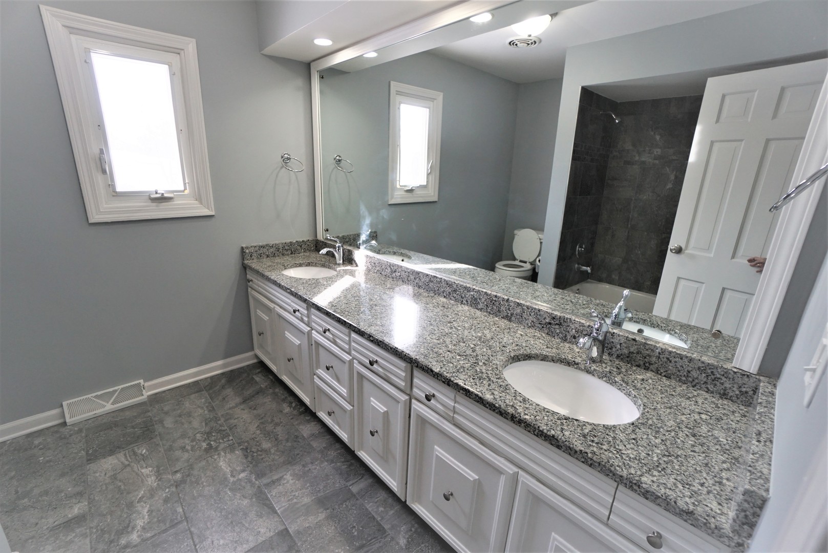 2842 Scott Crescent Flossmoor, IL 60422 - Photo 22 of 43 a bathroom with sinks granite countertop a sink and a mirror
