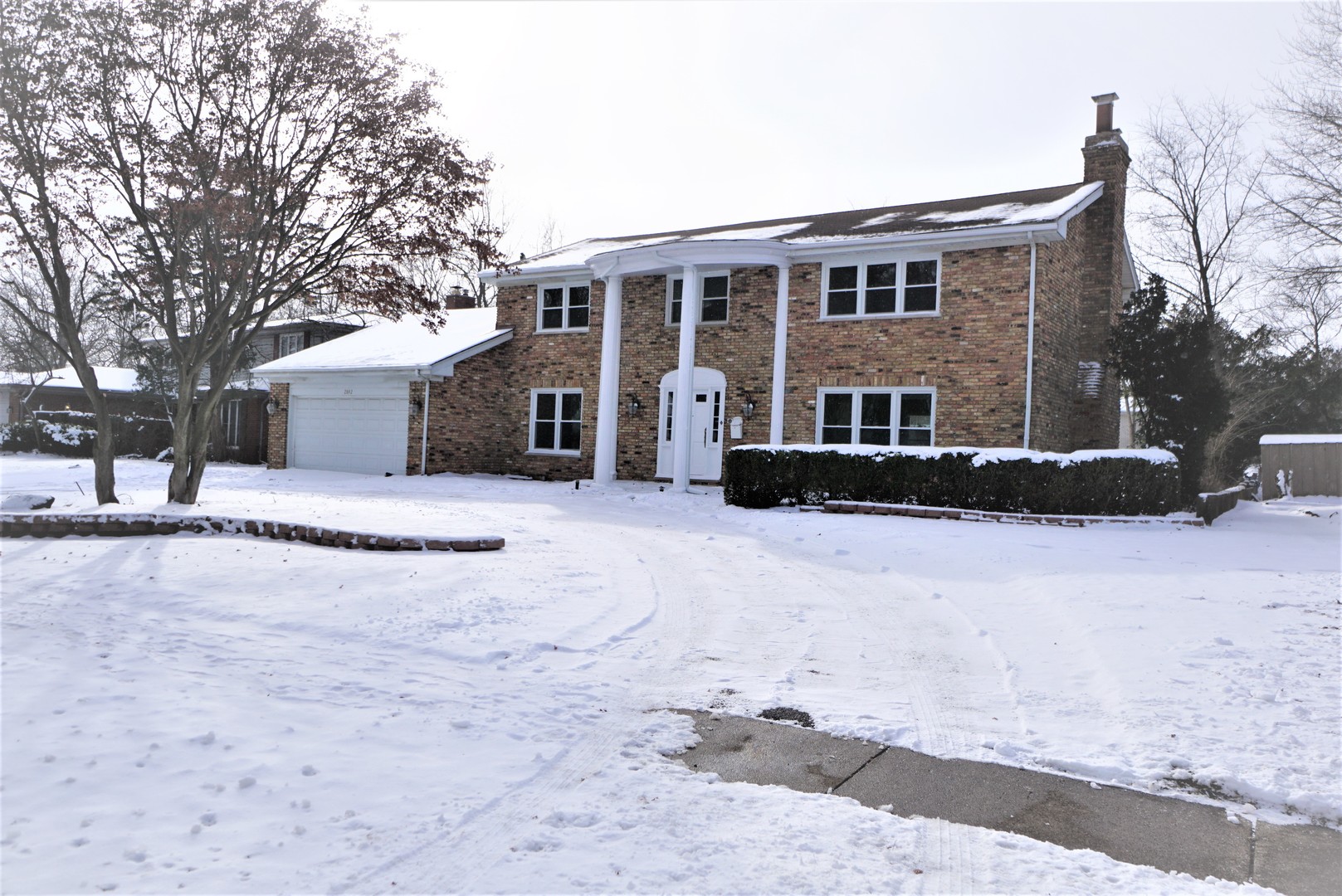 2842 Scott Crescent Flossmoor, IL 60422 - Photo 43 of 43 a front view of a house with a yard covered in snow