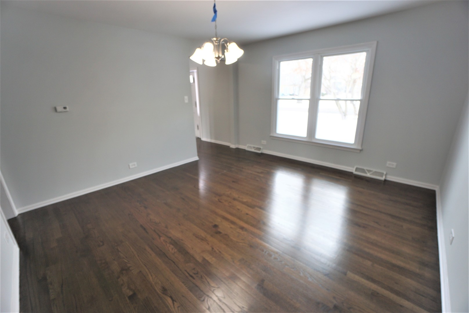 2842 Scott Crescent Flossmoor, IL 60422 - Photo 6 of 43 an empty room with wooden floor and windows