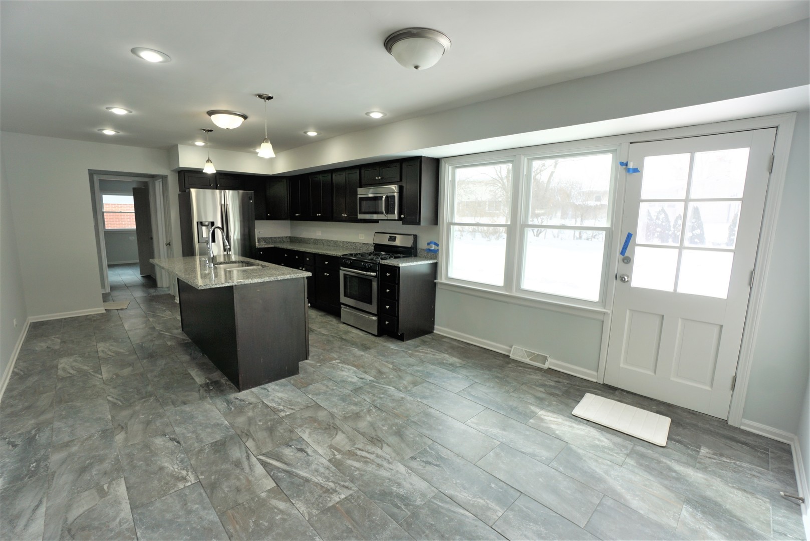 2842 Scott Crescent Flossmoor, IL 60422 - Photo 7 of 43 a view of a kitchen with a sink and dishwasher a oven with wooden floor
