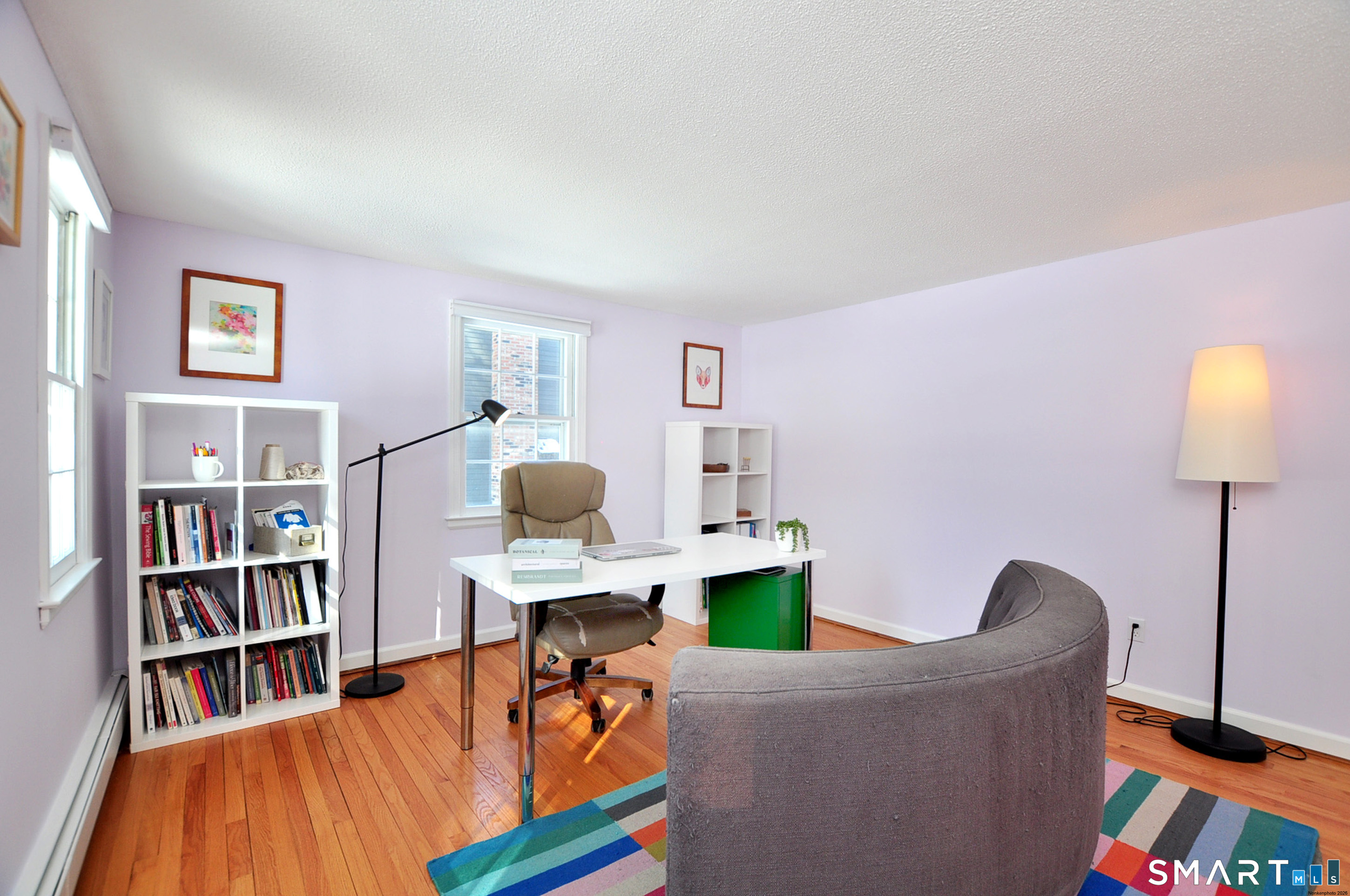 90 Seminary Road Simsbury, CT 06070 - Photo 14 of 34 a living room with furniture and a book shelf