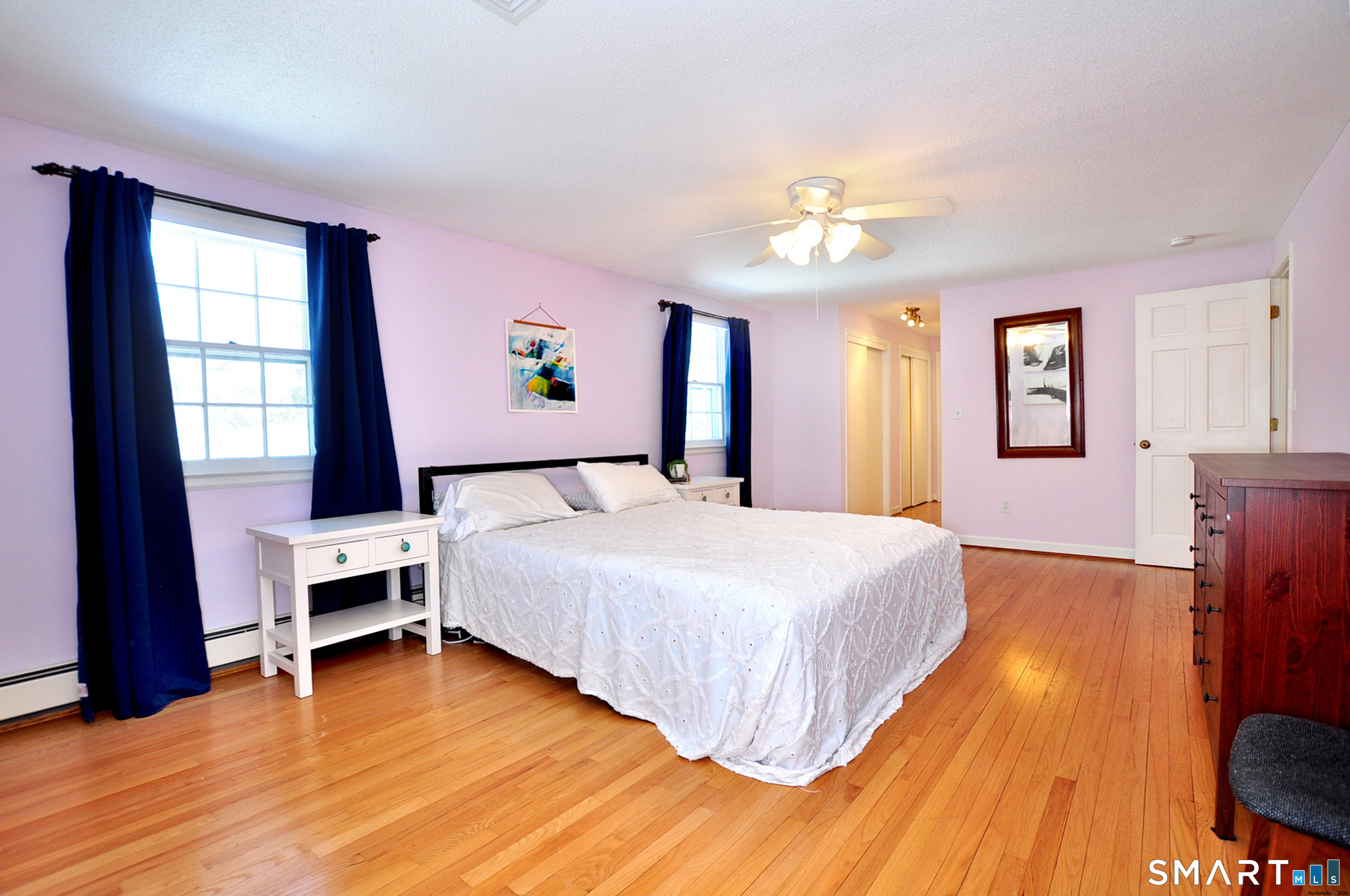 90 Seminary Road Simsbury, CT 06070 - Photo 19 of 34 a bedroom with a bed and a chandelier