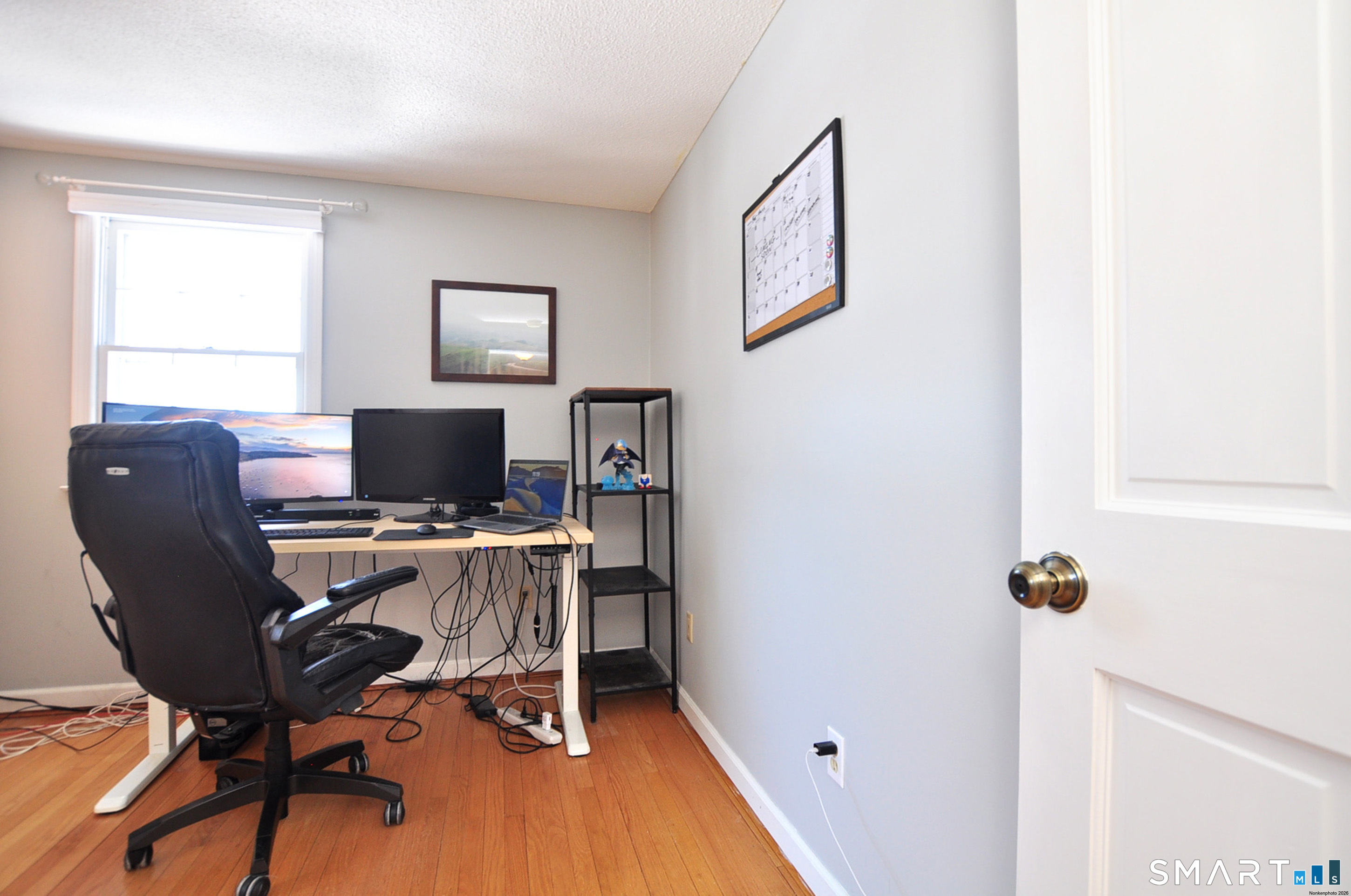 90 Seminary Road Simsbury, CT 06070 - Photo 24 of 34 a view of a workspace with furniture and a window