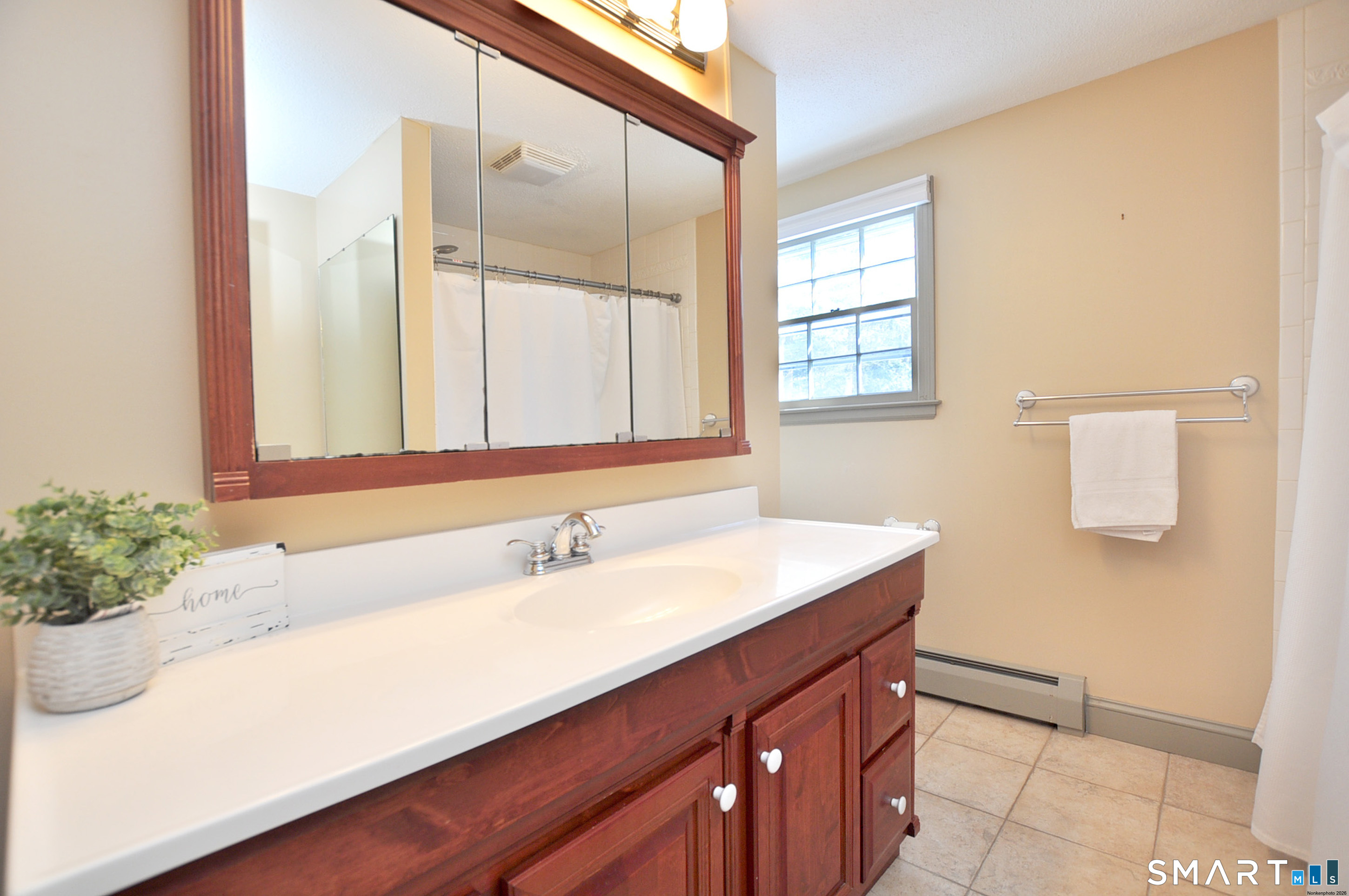 90 Seminary Road Simsbury, CT 06070 - Photo 26 of 34 a bathroom with a sink and a mirror
