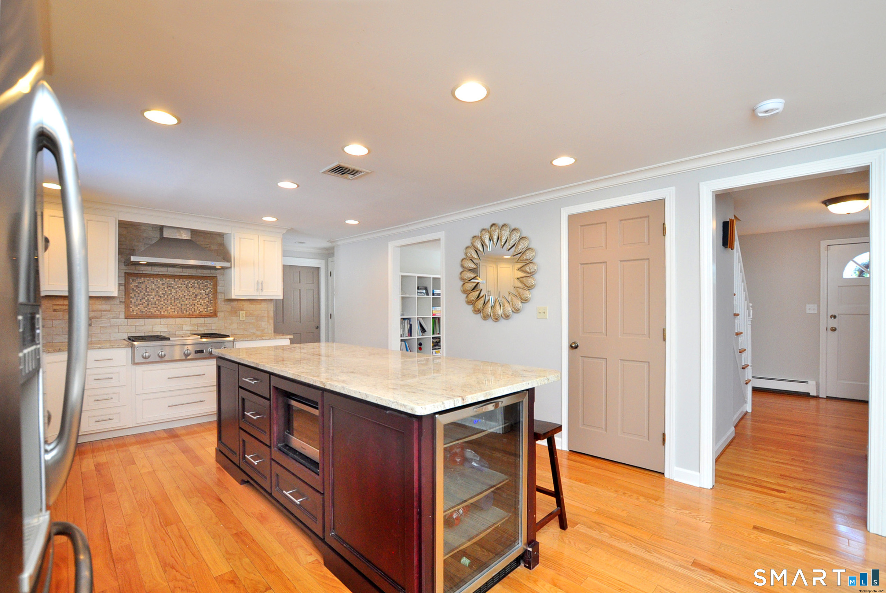 90 Seminary Road Simsbury, CT 06070 - Photo 28 of 34 a kitchen with stainless steel appliances granite countertop a sink a stove and a refrigerator