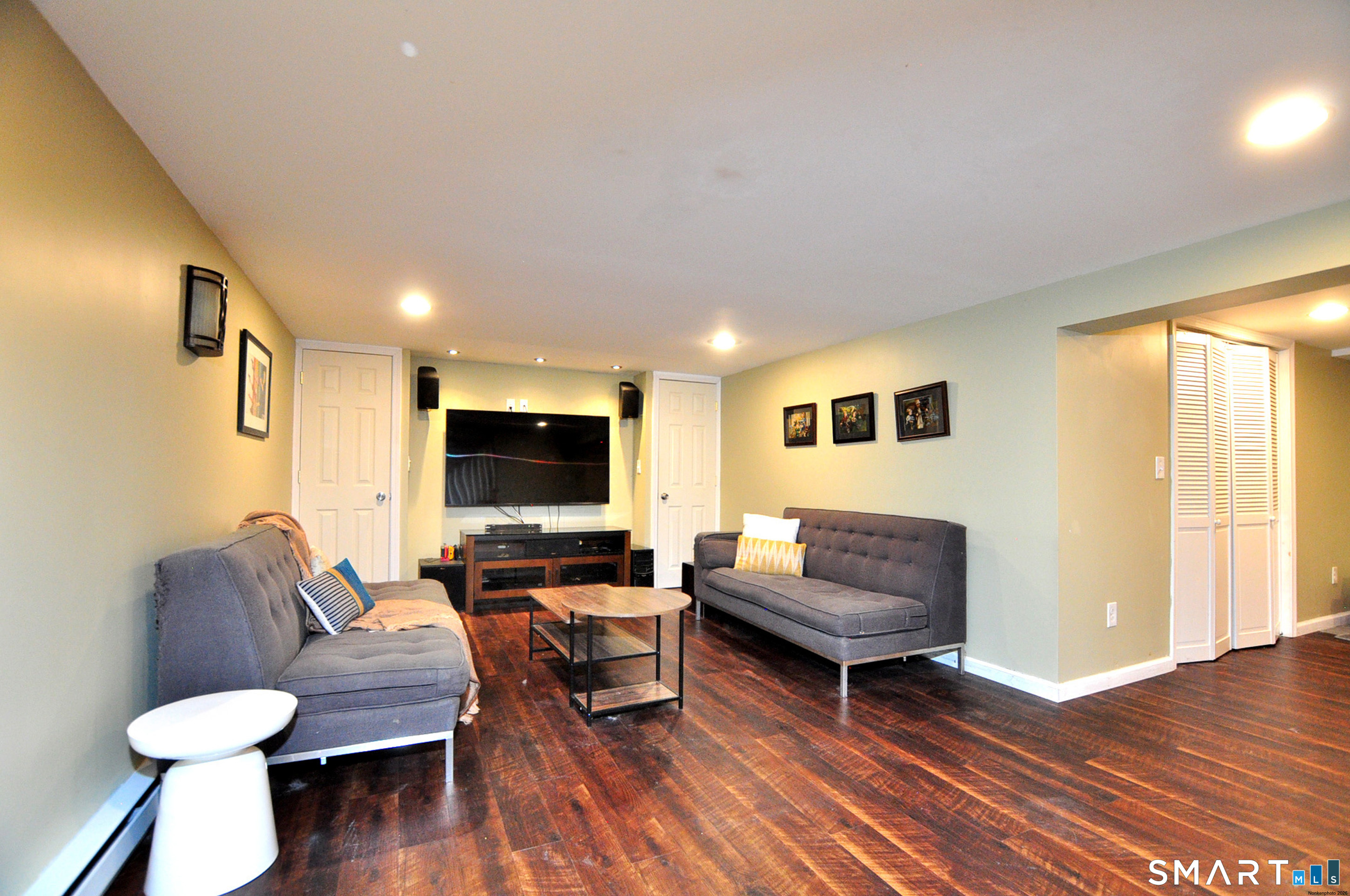 90 Seminary Road Simsbury, CT 06070 - Photo 30 of 34 a living room with furniture and a flat screen tv