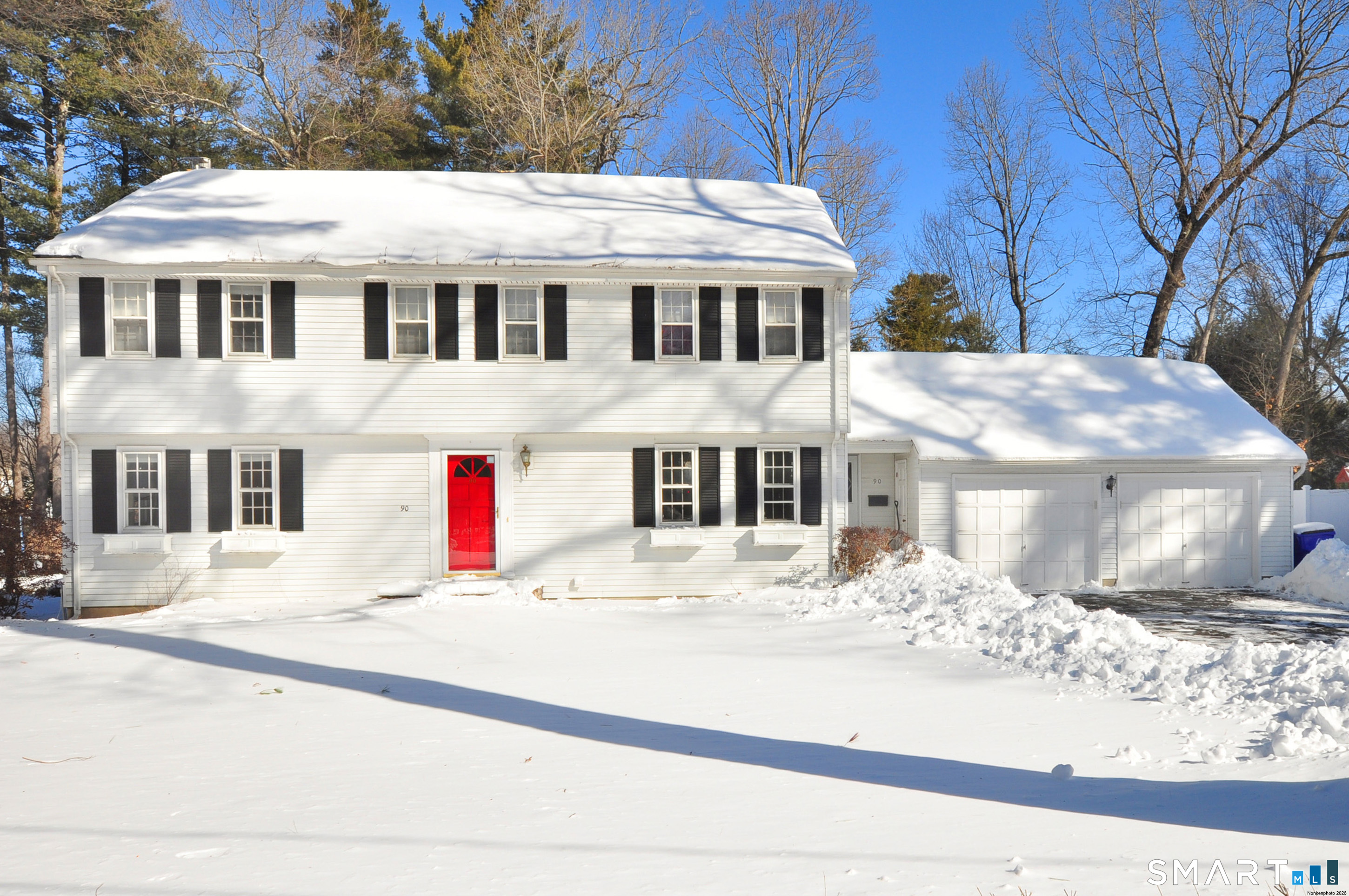 90 Seminary Road Simsbury, CT 06070 - Photo 5 of 34 a view of a white house with a large tree