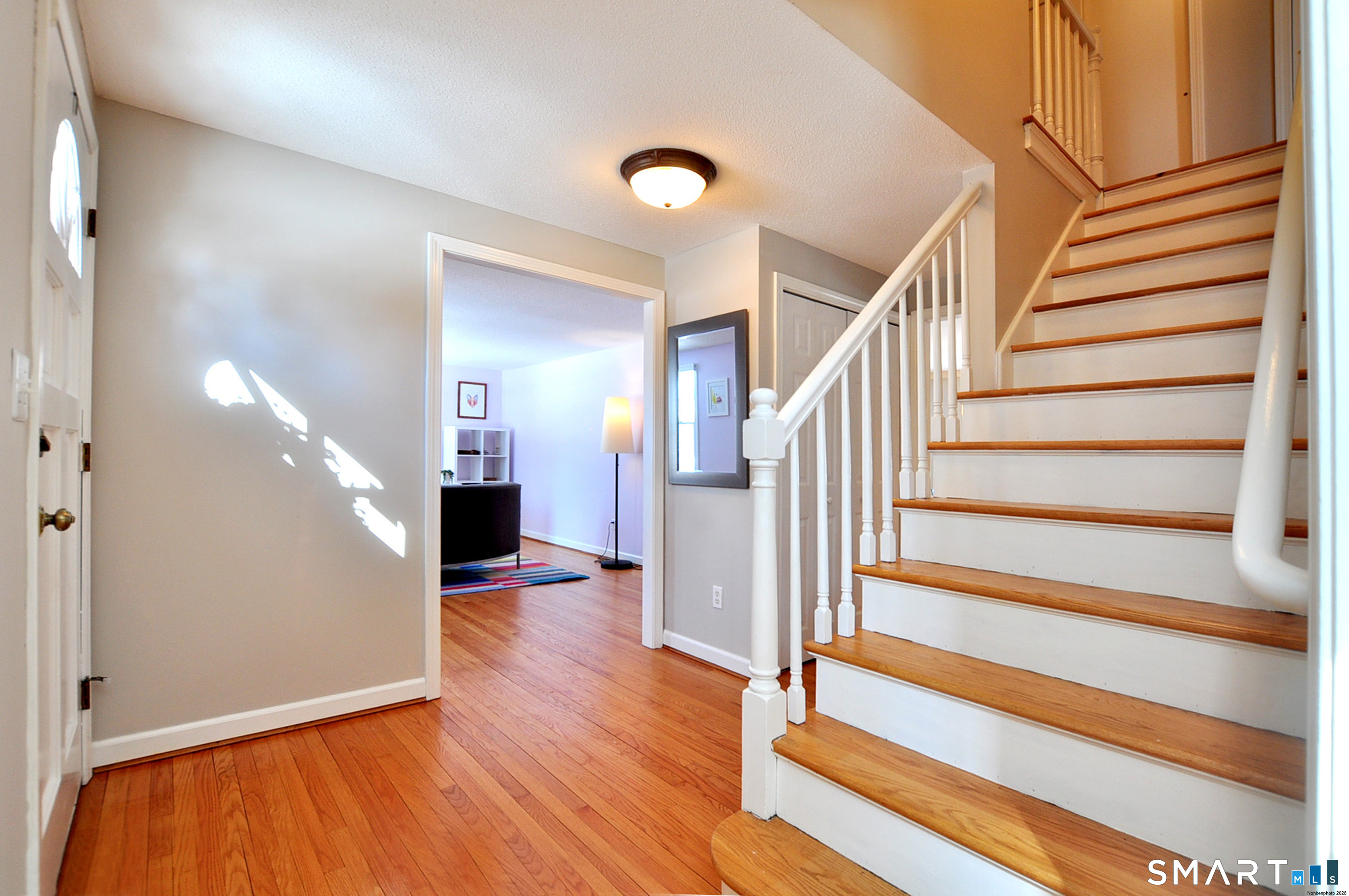 90 Seminary Road Simsbury, CT 06070 - Photo 6 of 34 a view of entryway and hall with wooden floor
