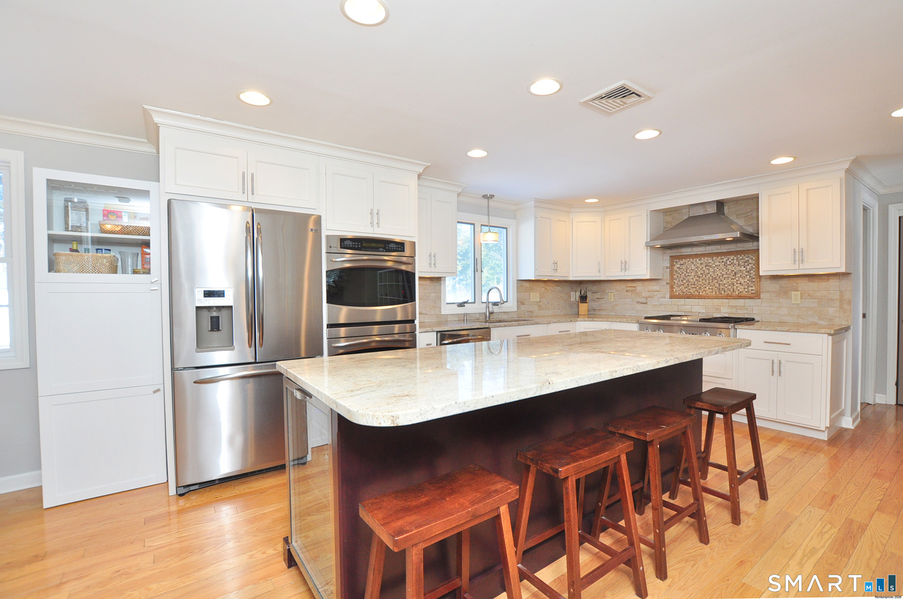 90 Seminary Road Simsbury, CT 06070 - Photo 7 of 34 a kitchen with stainless steel appliances granite countertop a sink a stove a refrigerator and a refrigerator