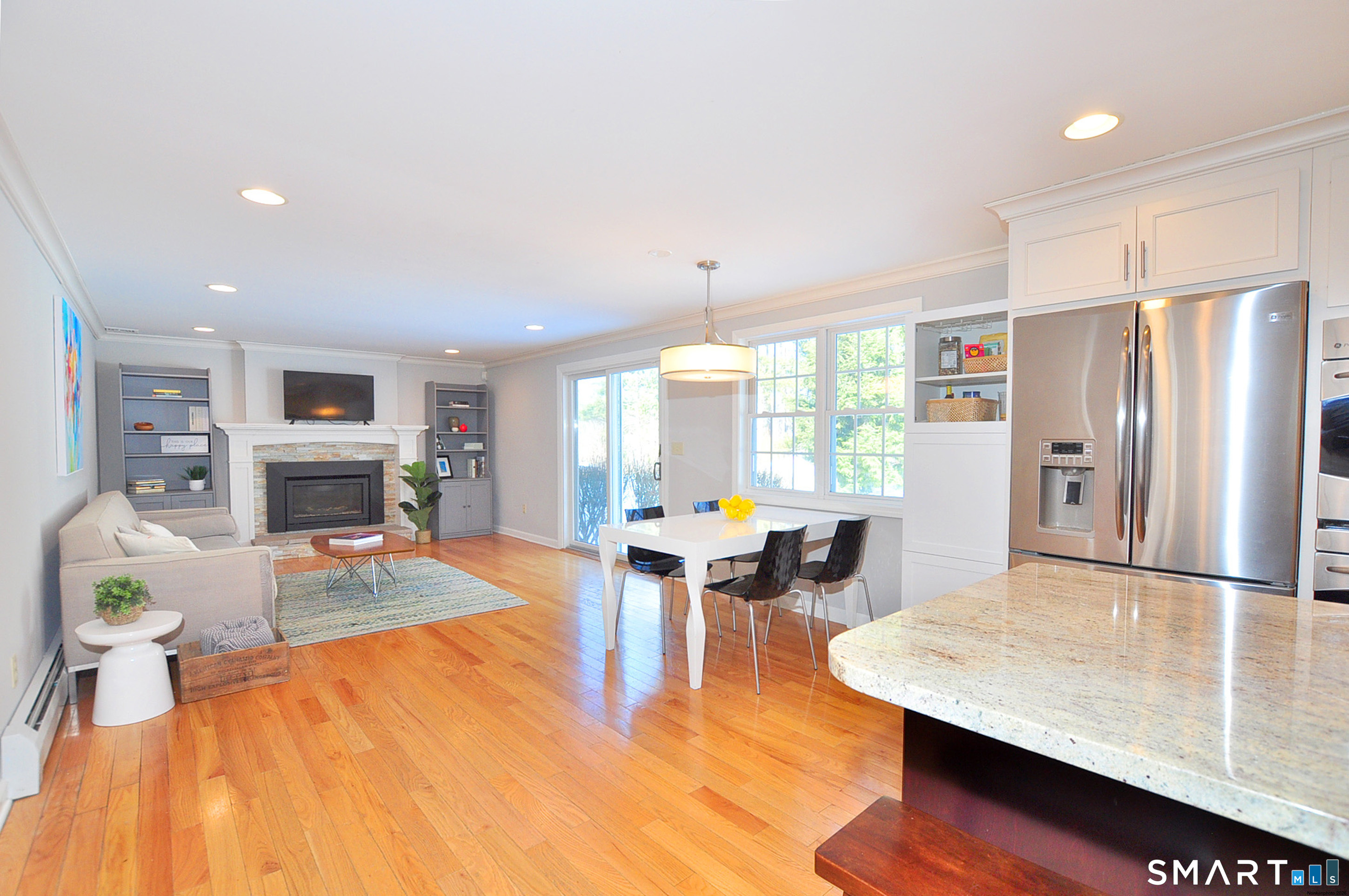 90 Seminary Road Simsbury, CT 06070 - Photo 10 of 34 a living room with fireplace furniture and a wooden floor