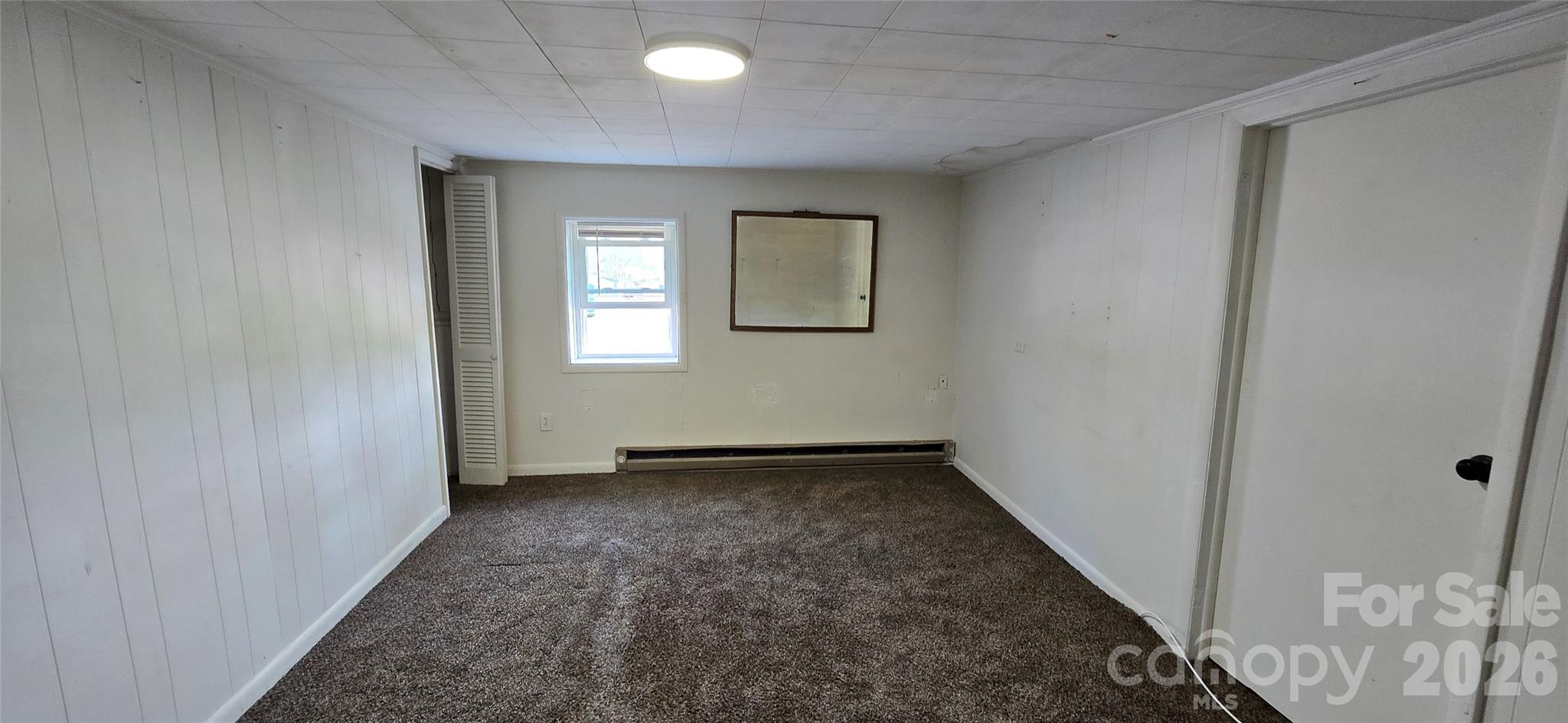 4169 Grace Chapel Road Granite Falls, NC 28630 - Photo 17 of 31 an empty room with windows