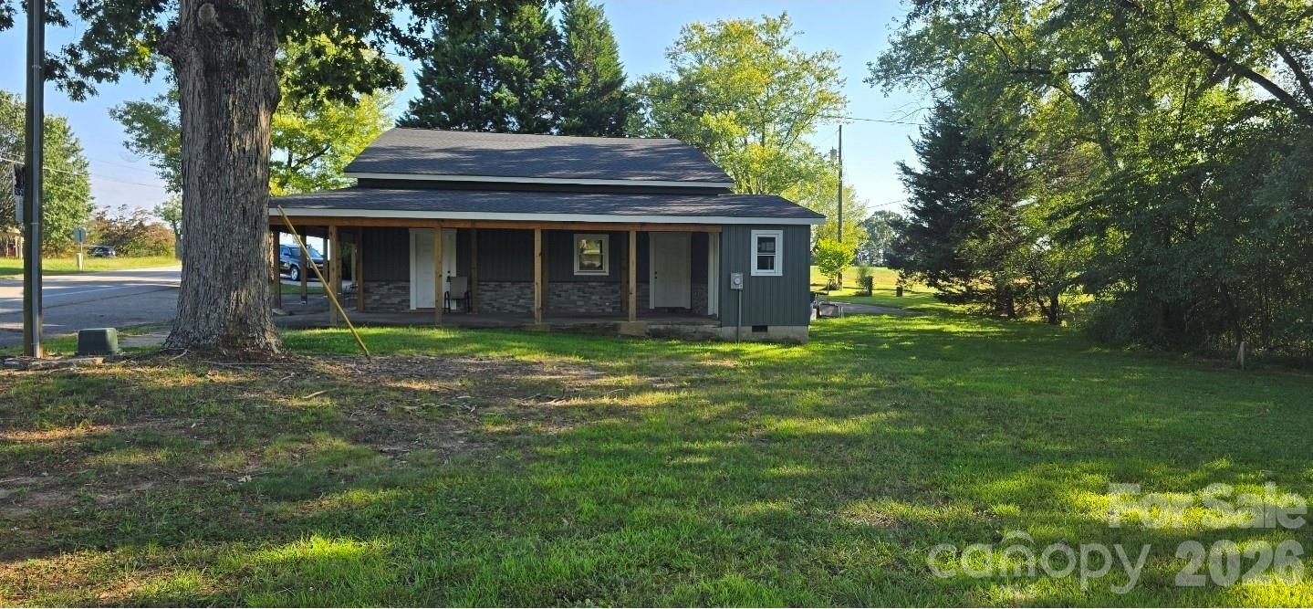 4169 Grace Chapel Road Granite Falls, NC 28630 - Photo 22 of 31 a view of a house with a yard