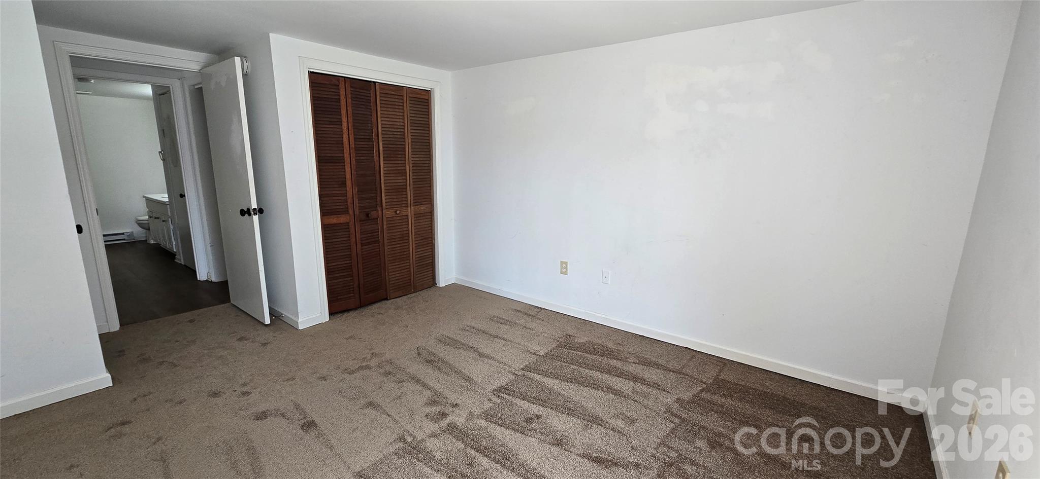 4169 Grace Chapel Road Granite Falls, NC 28630 - Photo 3 of 31 an empty room with a door