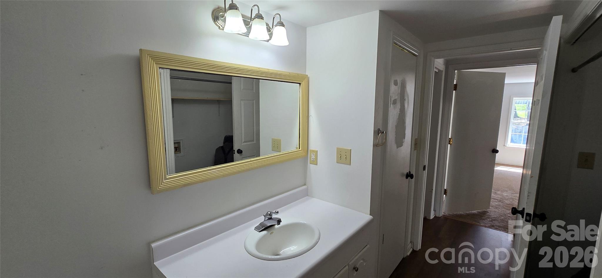 4169 Grace Chapel Road Granite Falls, NC 28630 - Photo 4 of 31 a bathroom with a sink and a mirror