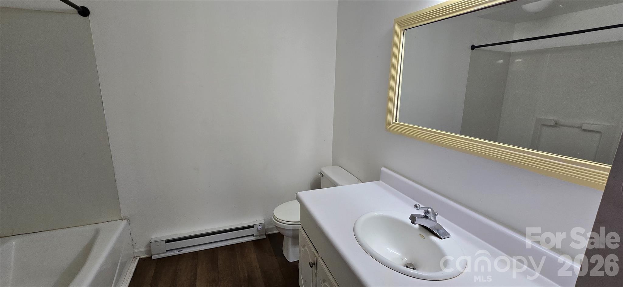 4169 Grace Chapel Road Granite Falls, NC 28630 - Photo 5 of 31 a bathroom with a sink and a toilet