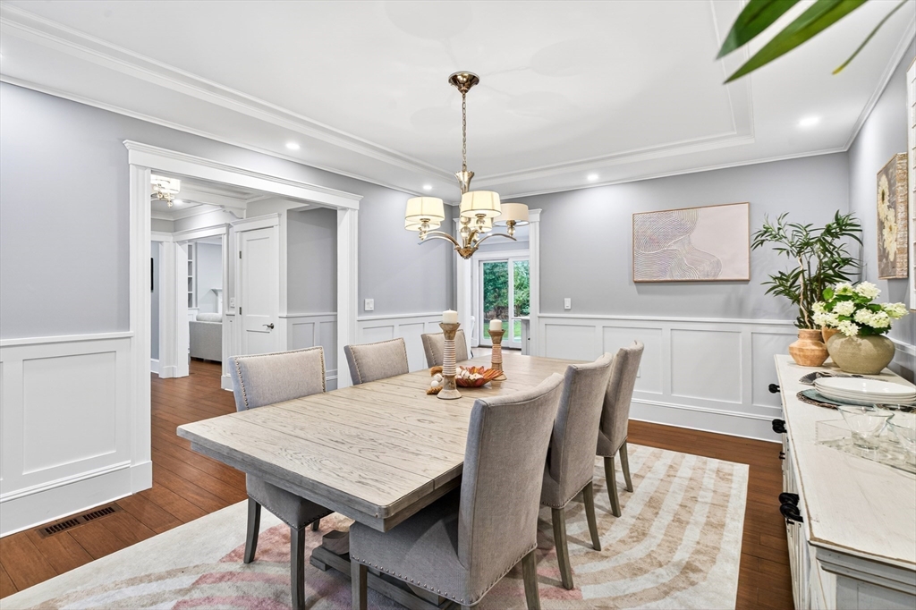 524 Ward Street Newton, MA 02459 - Photo 18 of 42 a dining room with furniture potted plants and wooden floor