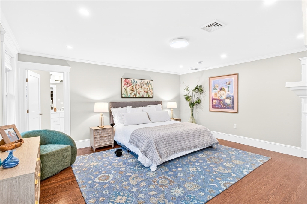 524 Ward Street Newton, MA 02459 - Photo 22 of 42 a spacious bedroom with a bed and a couch