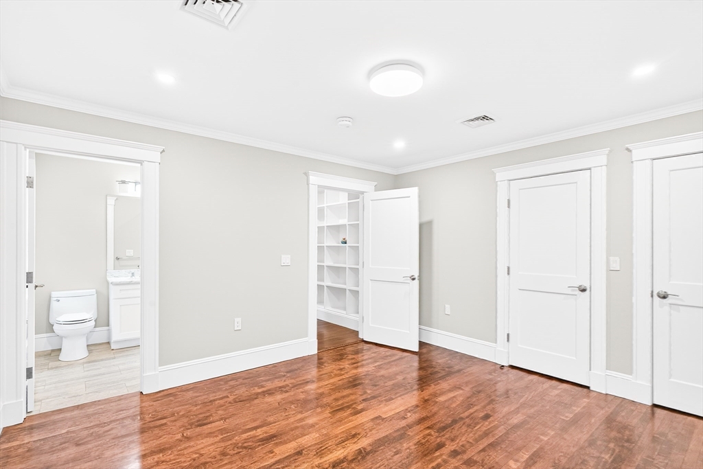 524 Ward Street Newton, MA 02459 - Photo 28 of 42 a view of an empty room with wooden floor