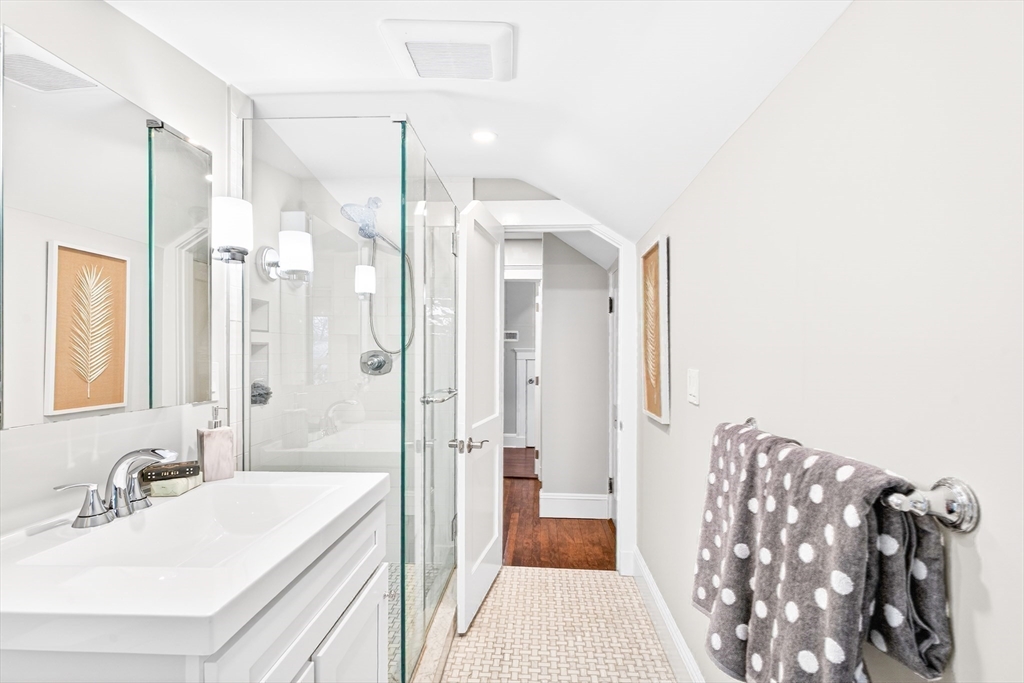 524 Ward Street Newton, MA 02459 - Photo 31 of 42 a bathroom with a sink a mirror and a shower