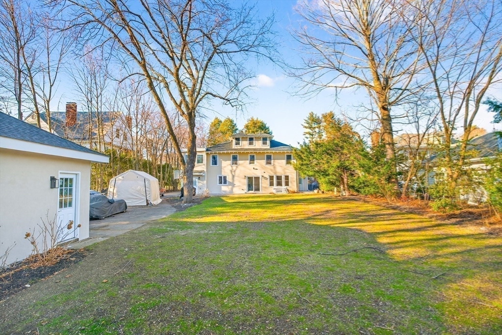 524 Ward Street Newton, MA 02459 - Photo 38 of 42 a view of a house with a large trees and a big yard