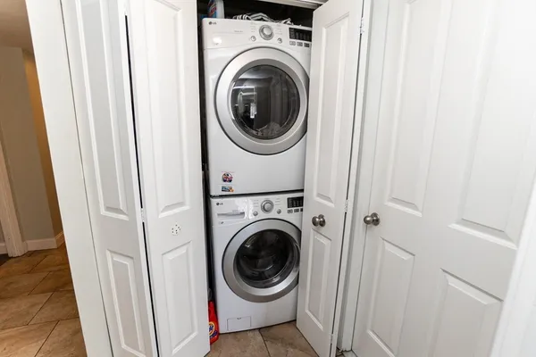 a view of a hallway with washer and dryer