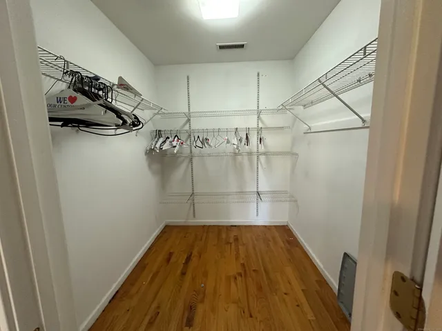 a view of a room with racks on the wall