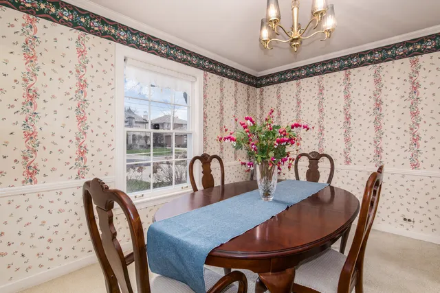 a dining room with furniture and window