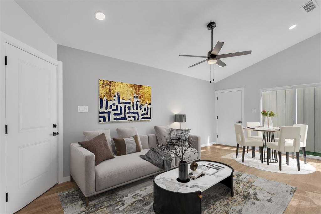 Open concept living and dining. Staged pic