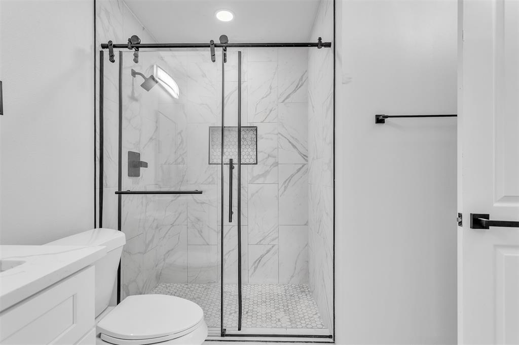 17676 Kelly Boulevard Dallas, TX 75287 - Photo 10 of 18 Oversized tiled shower in the primary bath