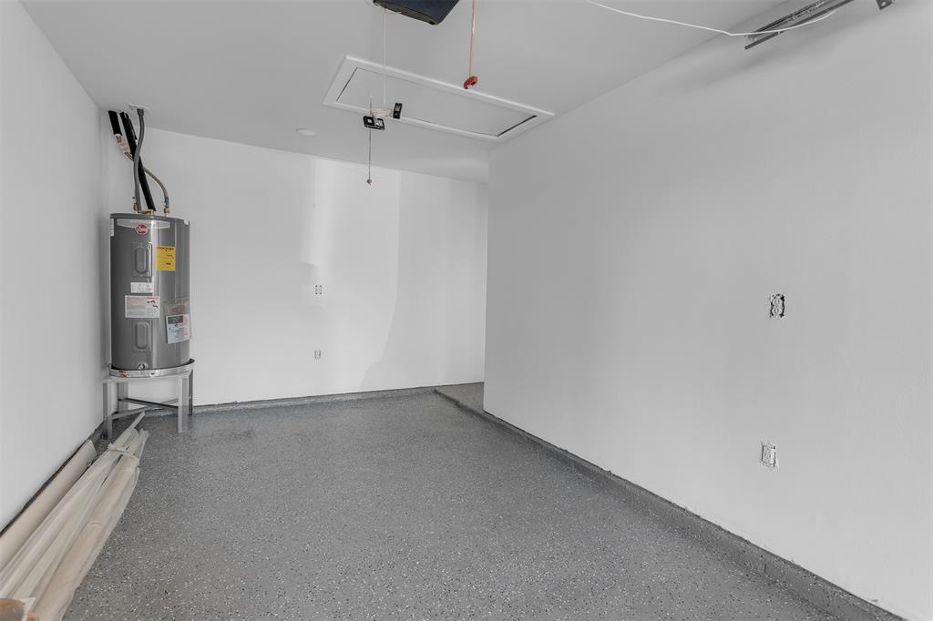 17676 Kelly Boulevard Dallas, TX 75287 - Photo 15 of 18 New water heater and sealed floor in the garage