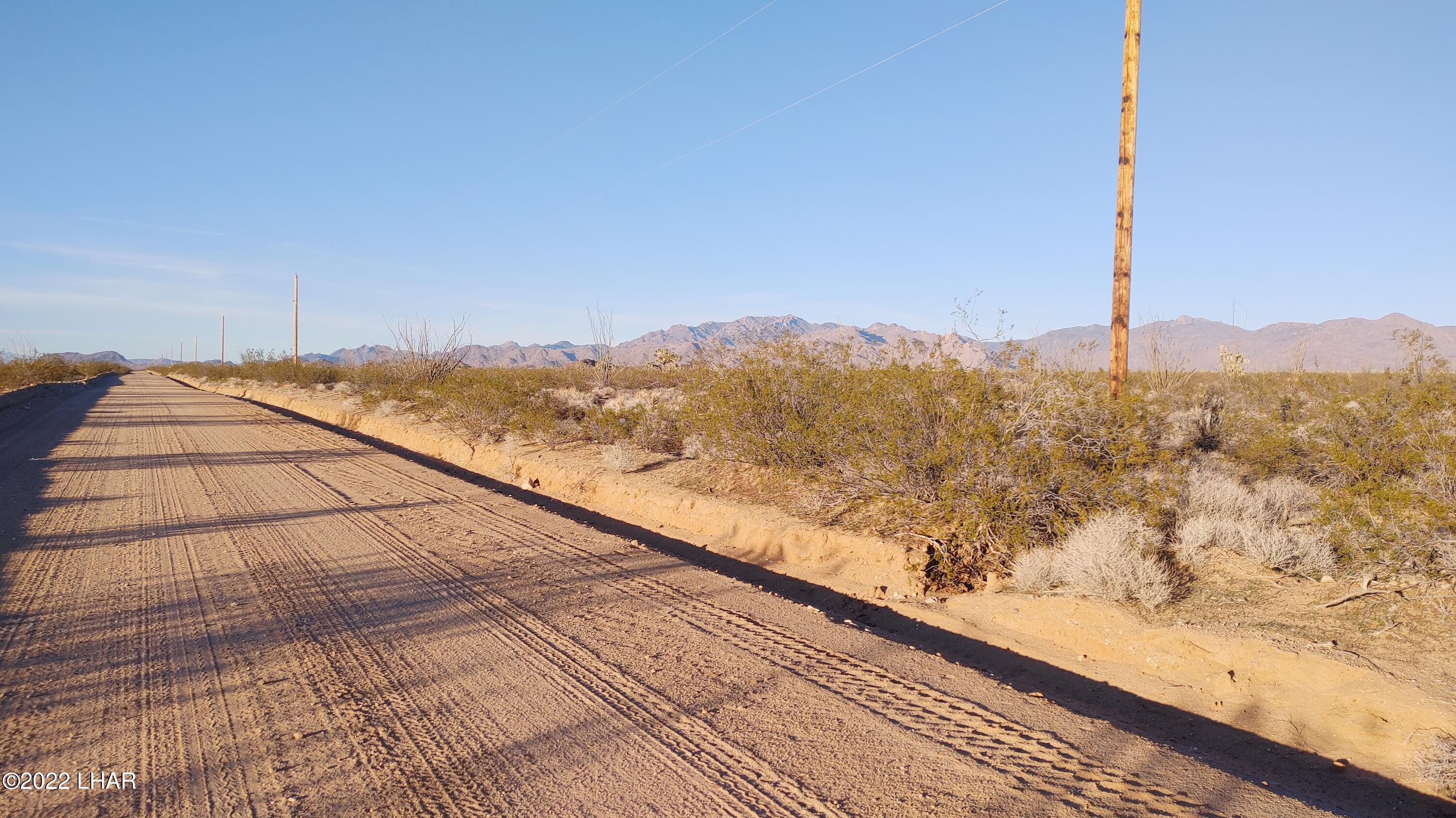 3384 South Custer Road Yucca, AZ 86438 - Photo 7 of 32 10-minutes to I-40 for easy access on firm dirt roads