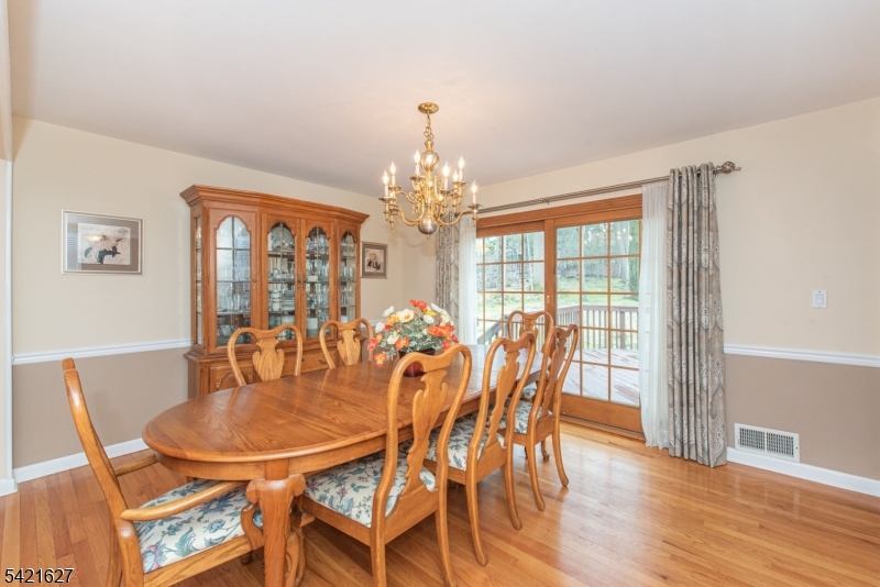 4 Oak Ridge North Caldwell, NJ 07006 - Photo 12 of 33 a dining room with furniture a chandelier and wooden floor