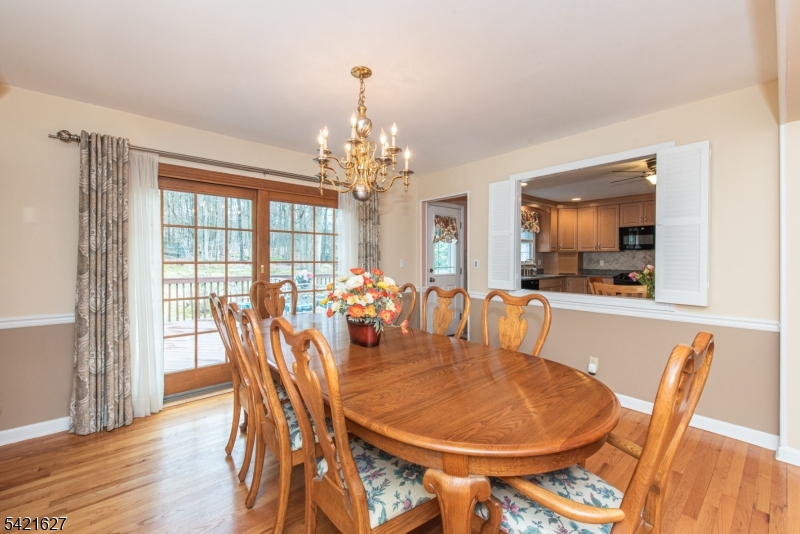 4 Oak Ridge North Caldwell, NJ 07006 - Photo 13 of 33 a dining room with furniture a chandelier and wooden floor