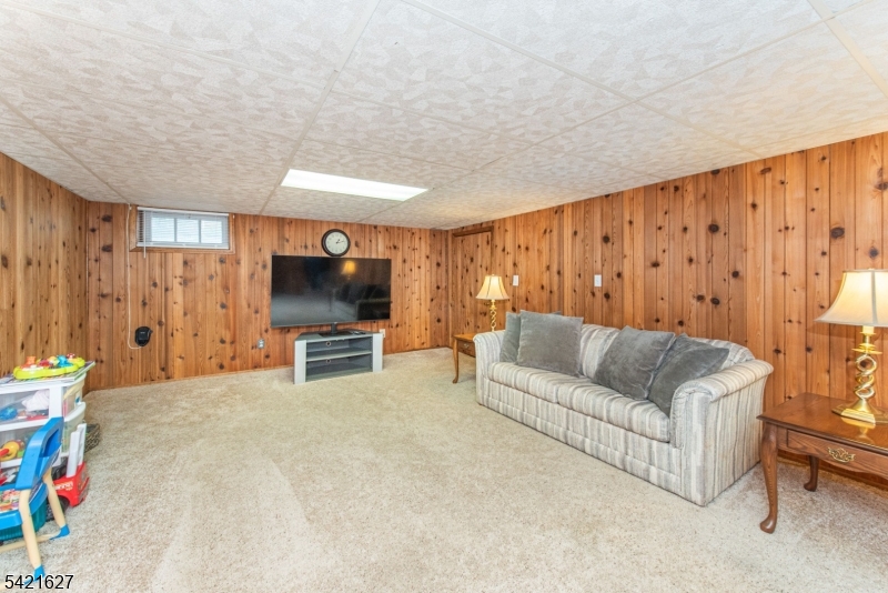 4 Oak Ridge North Caldwell, NJ 07006 - Photo 27 of 33 a living room with furniture and a flat screen tv