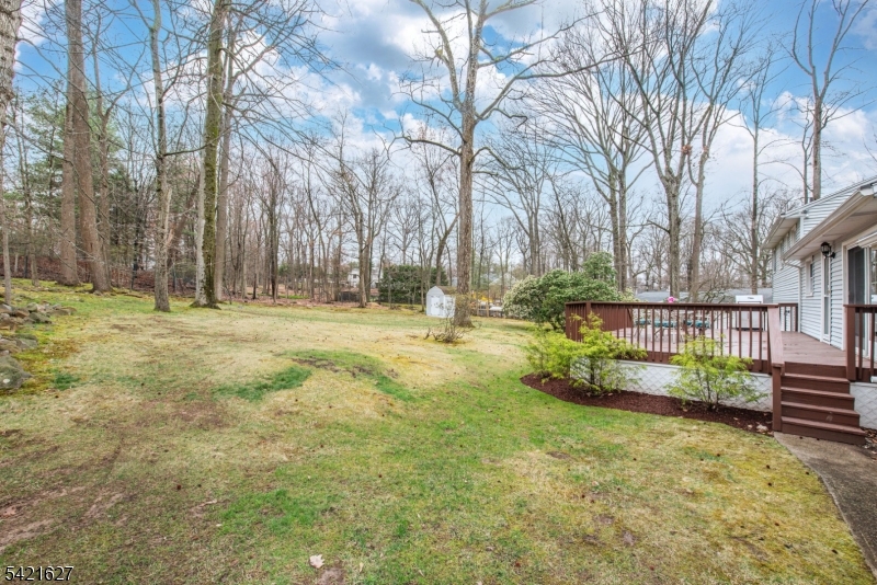 4 Oak Ridge North Caldwell, NJ 07006 - Photo 31 of 33 a backyard of a house with lots of green space
