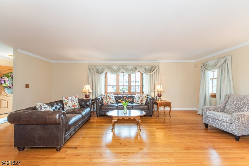 4 Oak Ridge North Caldwell, NJ 07006 - Photo 6 of 33 a living room with furniture and a large window