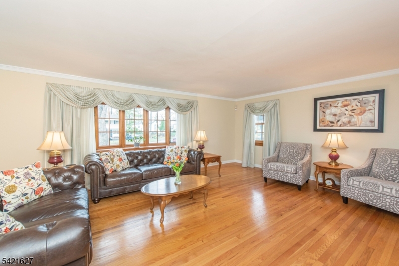 4 Oak Ridge North Caldwell, NJ 07006 - Photo 7 of 33 a living room with furniture and a large window