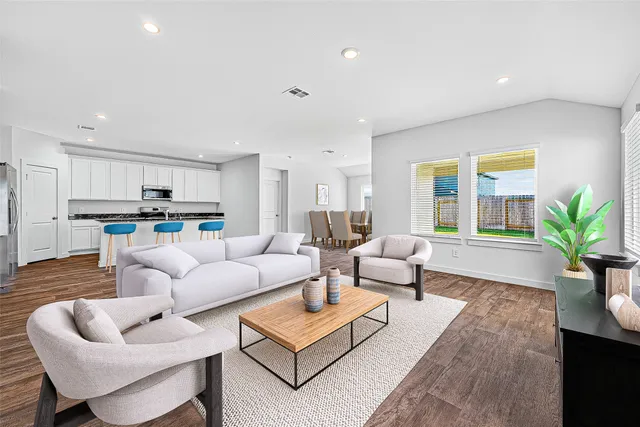 a living room with furniture and a large window